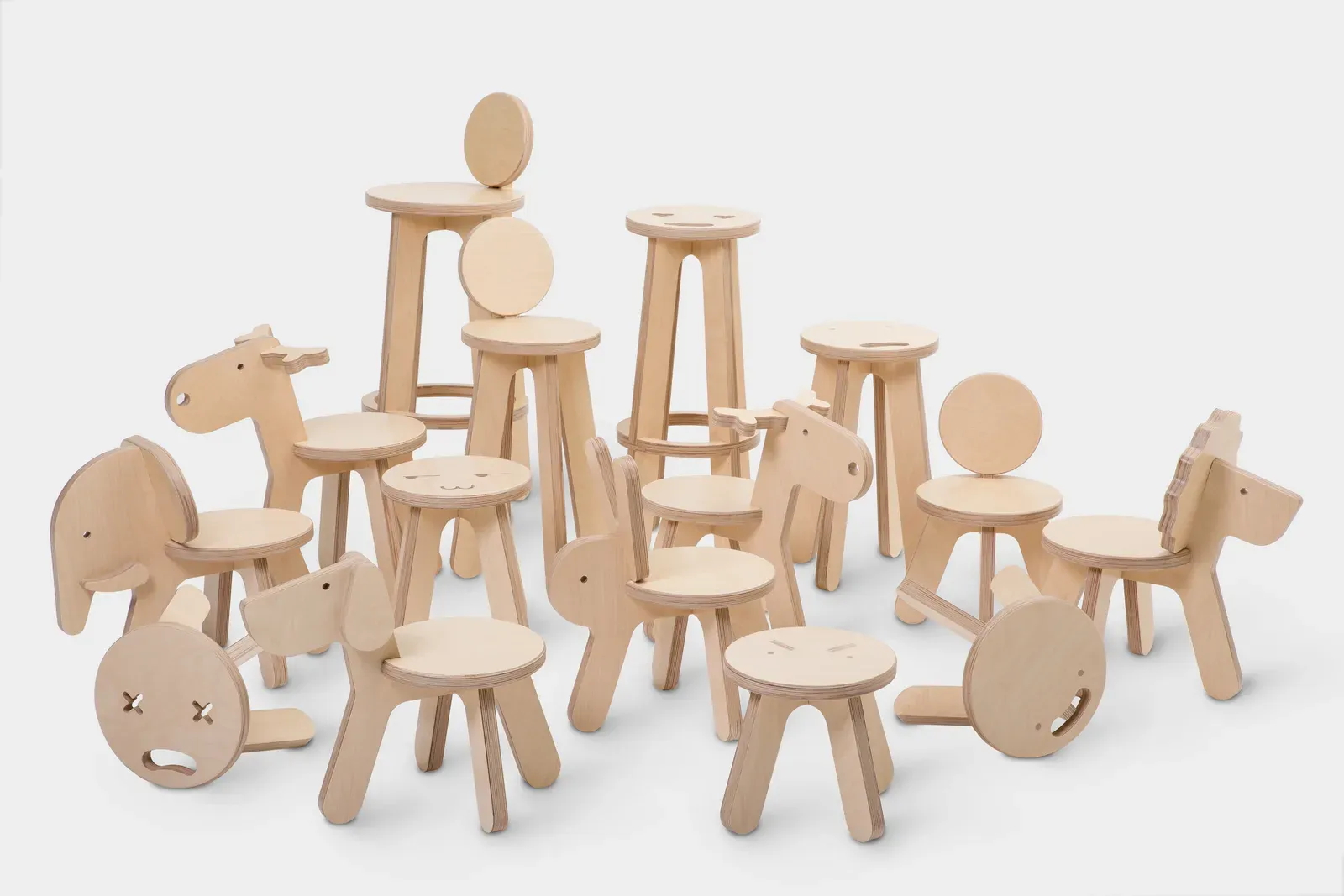A family of plywood stools and animal-shaped children’s seats