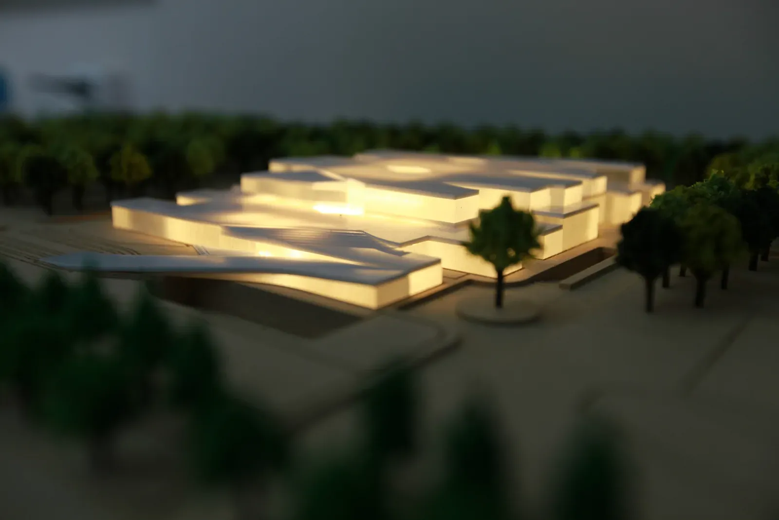 Lit physical model at night, seen from ground level