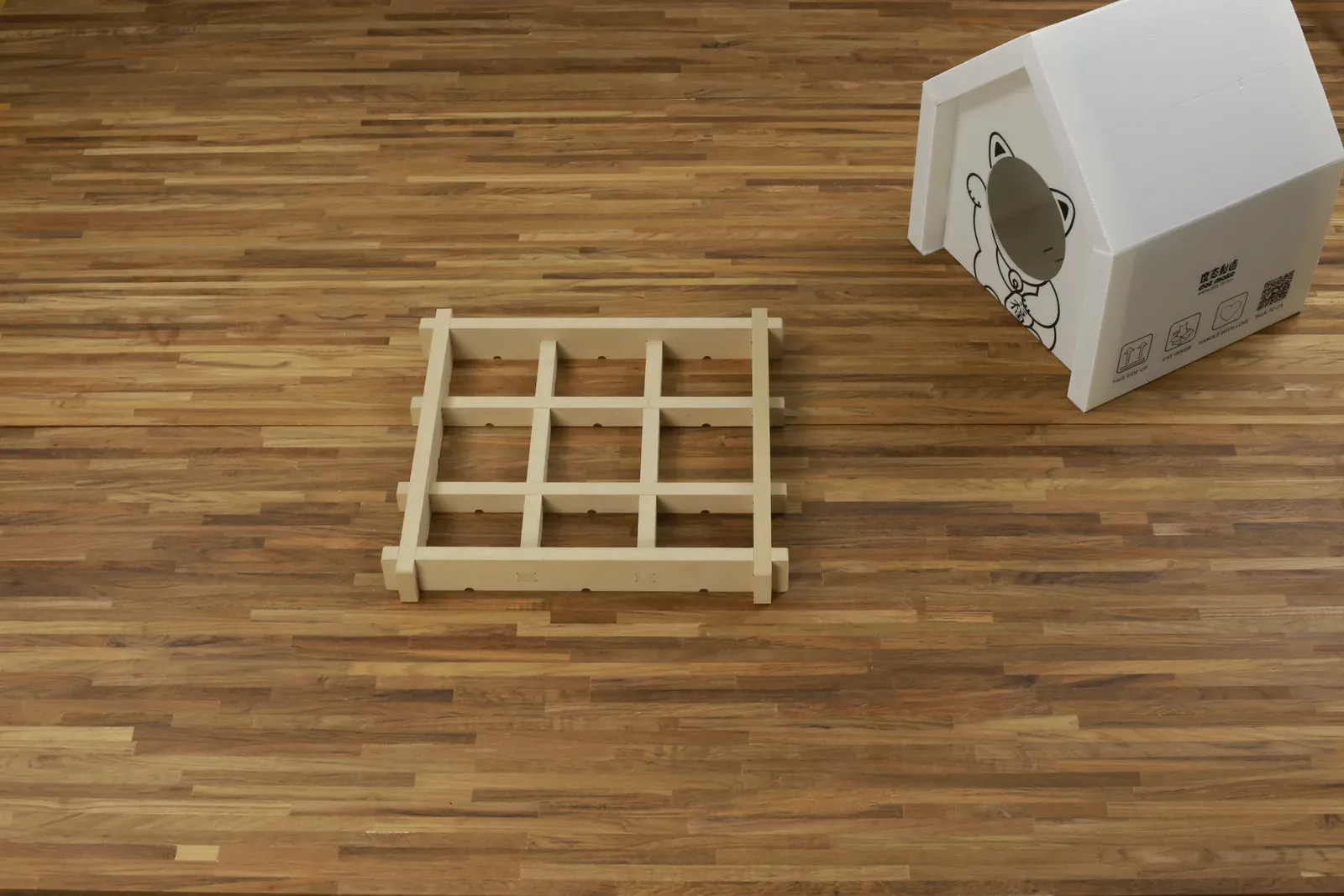 CNC-cut base frame next to the folded shell